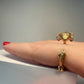 La Petite Dragonne wearing Earrings / 18K Gold Ring & Standing Sculpture