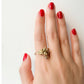 La Petite Dragonne wearing Earrings / 18K Gold Ring & Standing Sculpture