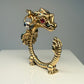 La Petite Dragonne wearing Earrings / 18K Gold Ring & Standing Sculpture