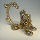 La Petite Dragonne wearing Earrings / 18K Gold Ring & Standing Sculpture